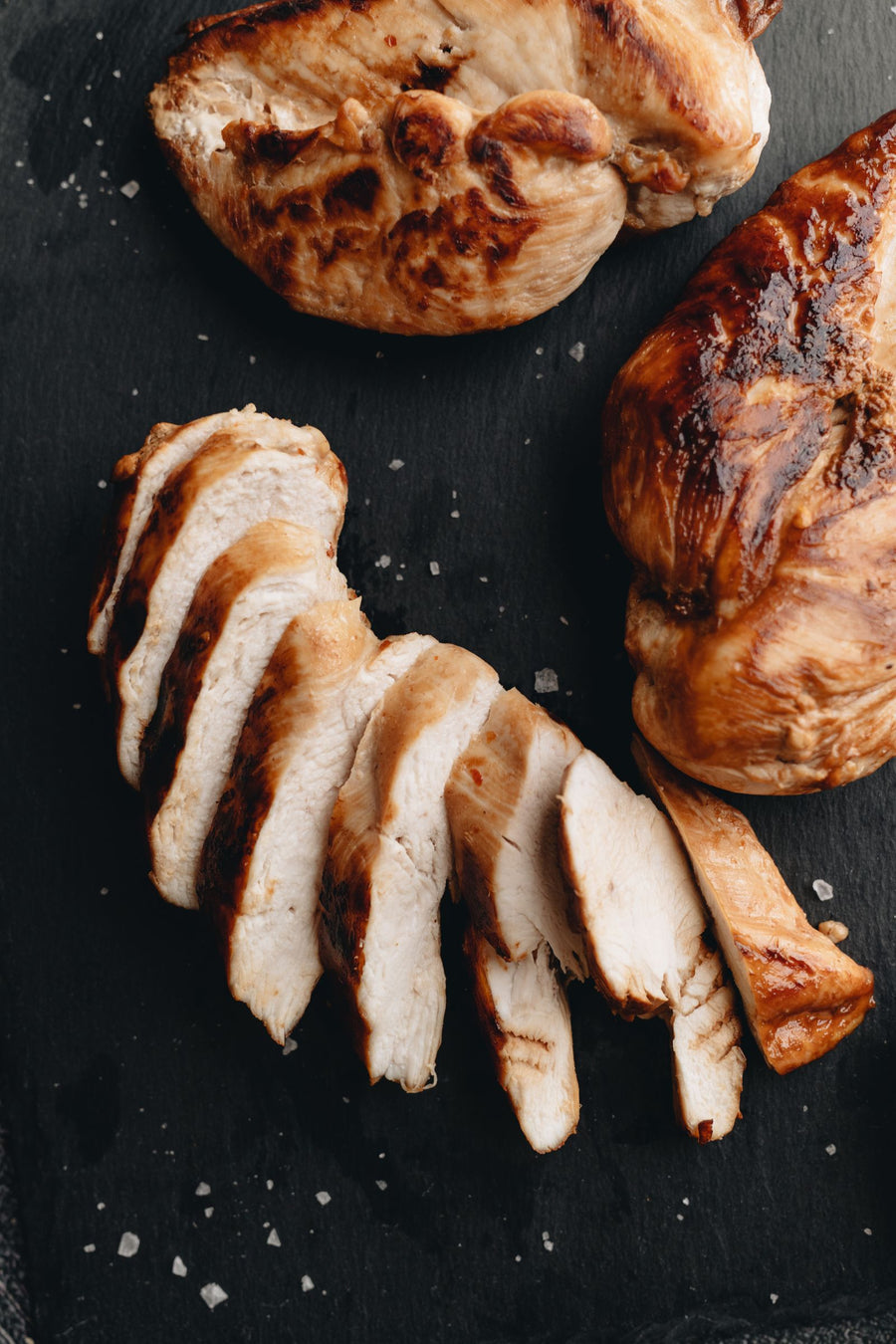 Sliced and whole grilled chicken breast